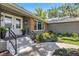 Inviting front entrance featuring double doors, modern lighting, and newly landscaped surroundings at 5326 Nw 76Th Ct, Ocala, FL 34482