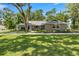 Charming one-story home boasts professional landscaping, newer paint, and updated shutters, enhancing its curb appeal at 5326 Nw 76Th Ct, Ocala, FL 34482