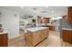 Spacious kitchen with stainless steel appliances, marble countertops, wood cabinets and island seating at 5326 Nw 76Th Ct, Ocala, FL 34482