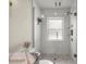 This stylish shower features elegant tiling, modern fixtures, and a glass door at 5326 Nw 76Th Ct, Ocala, FL 34482