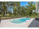 Private backyard swimming pool with surrounding trees at 5326 Nw 76Th Ct, Ocala, FL 34482