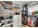 This walk-in closet with custom shelving has plenty of space for storage and organization at 5326 Nw 76Th Ct, Ocala, FL 34482