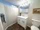 Well-lit bathroom with modern vanity, white cabinetry, and neutral décor at 588 Fairways Ln # E204, Ocala, FL 34472