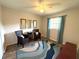 Inviting bedroom featuring ample natural light, comfortable seating, and decorative accents at 588 Fairways Ln # E204, Ocala, FL 34472