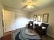 Bedroom featuring closet, natural light, neutral wall paint, ceiling fan, and accent mirrors at 588 Fairways Ln # E204, Ocala, FL 34472