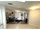 Open-concept living area showcases wood flooring, contemporary furnishings, and natural light from sliding glass doors at 588 Fairways Ln # E204, Ocala, FL 34472