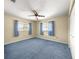 This is a cozy bedroom featuring a ceiling fan and two windows at 6263 Sw 107Th St, Ocala, FL 34476