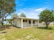 Well-maintained home with a manicured lawn and inviting front porch perfect for enjoying neighborhood views at 6263 Sw 107Th St, Ocala, FL 34476
