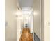 Hallway with plank floors leading to the bathroom at 6263 Sw 107Th St, Ocala, FL 34476