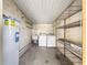 This is a laundry room featuring washer, dryer, and water heater at 6263 Sw 107Th St, Ocala, FL 34476