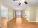 Bright living room boasts hardwood floors, ceiling fan, neutral paint and sliding glass door to the patio at 6263 Sw 107Th St, Ocala, FL 34476