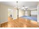 Open-concept living room with plank floors and natural lighting, perfect for entertaining at 6263 Sw 107Th St, Ocala, FL 34476