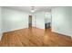Spacious main bedroom features a ceiling fan, plank floors, and ensuite bathroom access at 6263 Sw 107Th St, Ocala, FL 34476