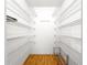 This walk-in closet features wood floors and multiple wire shelves for storage at 6263 Sw 107Th St, Ocala, FL 34476