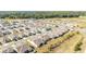 Planned community featuring neatly arranged homes, green spaces, and streets laid out in an organized aerial perspective at 6342 Sw 77Th Ave, Ocala, FL 34474