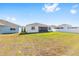 Spacious backyard featuring a white fence and views of neighboring homes at 6342 Sw 77Th Ave, Ocala, FL 34474
