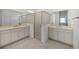 Bathroom with double sinks, frameless shower, and neutral colors creating a clean and modern space at 6342 Sw 77Th Ave, Ocala, FL 34474