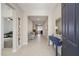 Bright entryway with neutral walls, tile flooring, and a charming welcome sign and decor at 6342 Sw 77Th Ave, Ocala, FL 34474