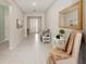 Bright entryway with neutral walls, tile flooring, and a charming welcome sign and decor at 6342 Sw 77Th Ave, Ocala, FL 34474