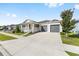 Lovely single-story home showcasing a spacious driveway and well-maintained lawn at 6342 Sw 77Th Ave, Ocala, FL 34474