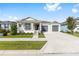 Beautiful single-story home with a covered porch, lush lawn, and convenient two-car garage at 6342 Sw 77Th Ave, Ocala, FL 34474