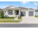 Charming single-story home featuring a welcoming front porch and two-car garage at 6342 Sw 77Th Ave, Ocala, FL 34474