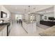Open concept kitchen featuring a large granite island and connecting living space at 6342 Sw 77Th Ave, Ocala, FL 34474