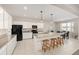 Modern kitchen featuring white cabinets, stainless steel appliances, granite countertops, and a center island at 6342 Sw 77Th Ave, Ocala, FL 34474