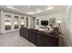 Bright living room featuring recessed lighting, a ceiling fan, large windows, and a comfortable gray sofa at 6342 Sw 77Th Ave, Ocala, FL 34474