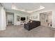 Well-lit living room with recessed lighting, a ceiling fan, a comfortable gray sofa and stylish decor at 6342 Sw 77Th Ave, Ocala, FL 34474