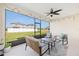 Screened patio offers outdoor living with comfortable seating and serene backyard views at 6342 Sw 77Th Ave, Ocala, FL 34474