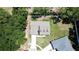 An overhead view of a single-Gathering home with an attached garage, set in a lush, green surrounding at 6600 Sw 109Th Ln, Ocala, FL 34476