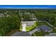 Aerial view of the house nestled amongst lush green trees at 6600 Sw 109Th Ln, Ocala, FL 34476