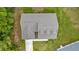 Aerial view of a charming single-story home with a well-manicured lawn at 6600 Sw 109Th Ln, Ocala, FL 34476