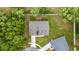 Aerial view of a charming single-story home with a well-manicured lawn at 6600 Sw 109Th Ln, Ocala, FL 34476