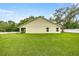 The backyard has a well-maintained lawn and property line landscaping at 6600 Sw 109Th Ln, Ocala, FL 34476