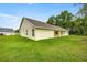 The backyard has a well-maintained lawn and property line landscaping at 6600 Sw 109Th Ln, Ocala, FL 34476