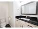 Bathroom featuring granite countertops, sleek fixtures, and modern toilet at 6600 Sw 109Th Ln, Ocala, FL 34476