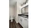 Bathroom with white cabinets and dark countertops, along with modern fixtures and a toilet at 6600 Sw 109Th Ln, Ocala, FL 34476