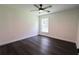 Bright bedroom featuring a ceiling fan and hardwood floors at 6600 Sw 109Th Ln, Ocala, FL 34476