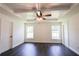 Spacious bedroom with tray ceiling, fan, and hardwood floors at 6600 Sw 109Th Ln, Ocala, FL 34476
