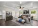 Bedroom features a ceiling fan, neutral color scheme, and large windows at 6600 Sw 109Th Ln, Ocala, FL 34476