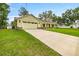 Charming single-story home with a two-car garage and a welcoming front porch at 6600 Sw 109Th Ln, Ocala, FL 34476