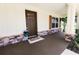 Lovely front porch featuring a welcome mat, potted plants, and stained wood shutters at 6600 Sw 109Th Ln, Ocala, FL 34476