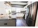 Bright kitchen features a center island, granite countertops, white cabinets, and stainless steel appliances at 6600 Sw 109Th Ln, Ocala, FL 34476
