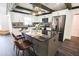 Bright kitchen features a center island, granite countertops, white cabinets, and stainless steel appliances at 6600 Sw 109Th Ln, Ocala, FL 34476