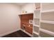 Bright laundry room boasts cedar accent wall, shelving and modern hookups at 6600 Sw 109Th Ln, Ocala, FL 34476