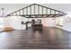 Large living space with hard floors, open floor plan, island kitchen and a window seat at 6600 Sw 109Th Ln, Ocala, FL 34476