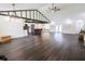 Open-concept living room featuring hard floors, island kitchen and seating, and modern fixtures at 6600 Sw 109Th Ln, Ocala, FL 34476