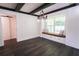 Living room features a cozy window seat, elegant chandelier, and ample natural light at 6600 Sw 109Th Ln, Ocala, FL 34476
